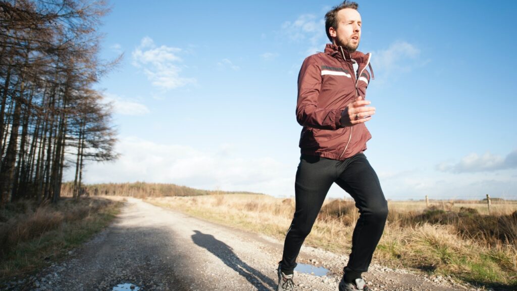 A person running on a road Photo by @jennyhill on Upsplash